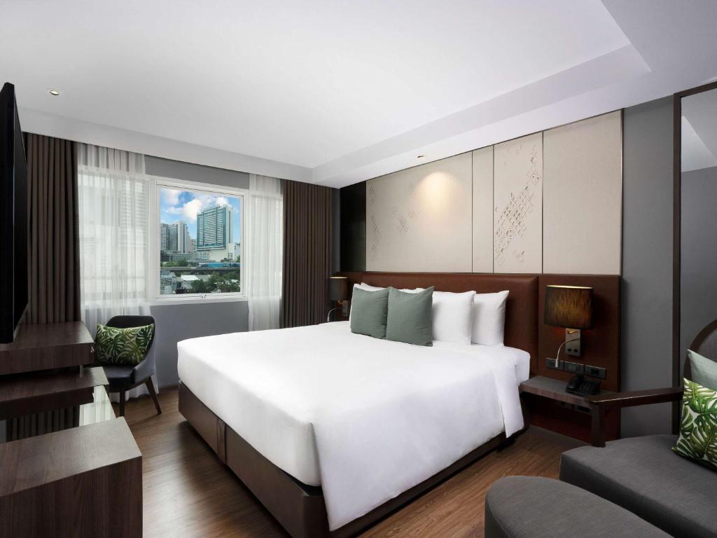 Postel nebo postele na pokoji v ubytování Novotel Living Bangkok Sukhumvit Legacy