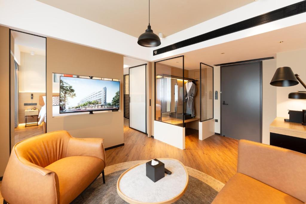 TV a/nebo společenská místnost v ubytování Mia Hotel - Shanghai Xuhui Jiaotong University