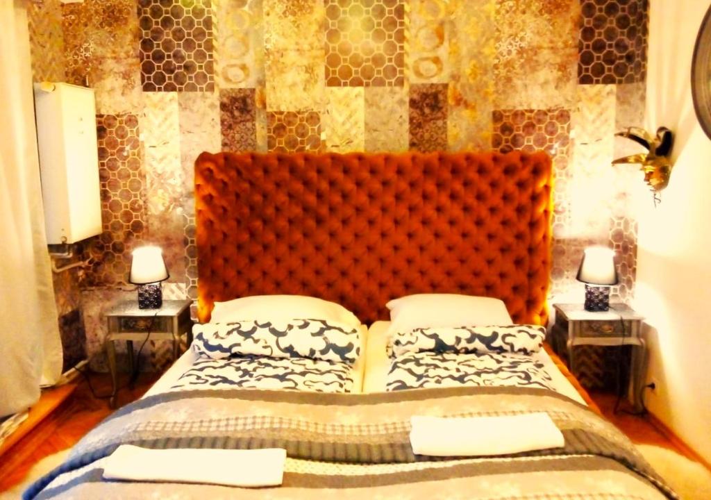 Posteľ alebo postele v izbe v ubytovaní Ambassador Apartament