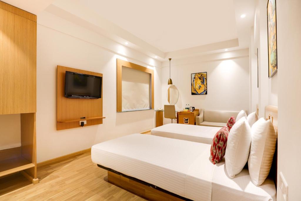 Postel nebo postele na pokoji v ubytování Lemon Tree Hotel Chandigarh