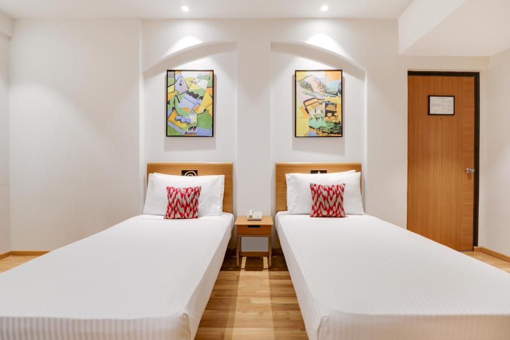 Postel nebo postele na pokoji v ubytování Lemon Tree Hotel Chandigarh