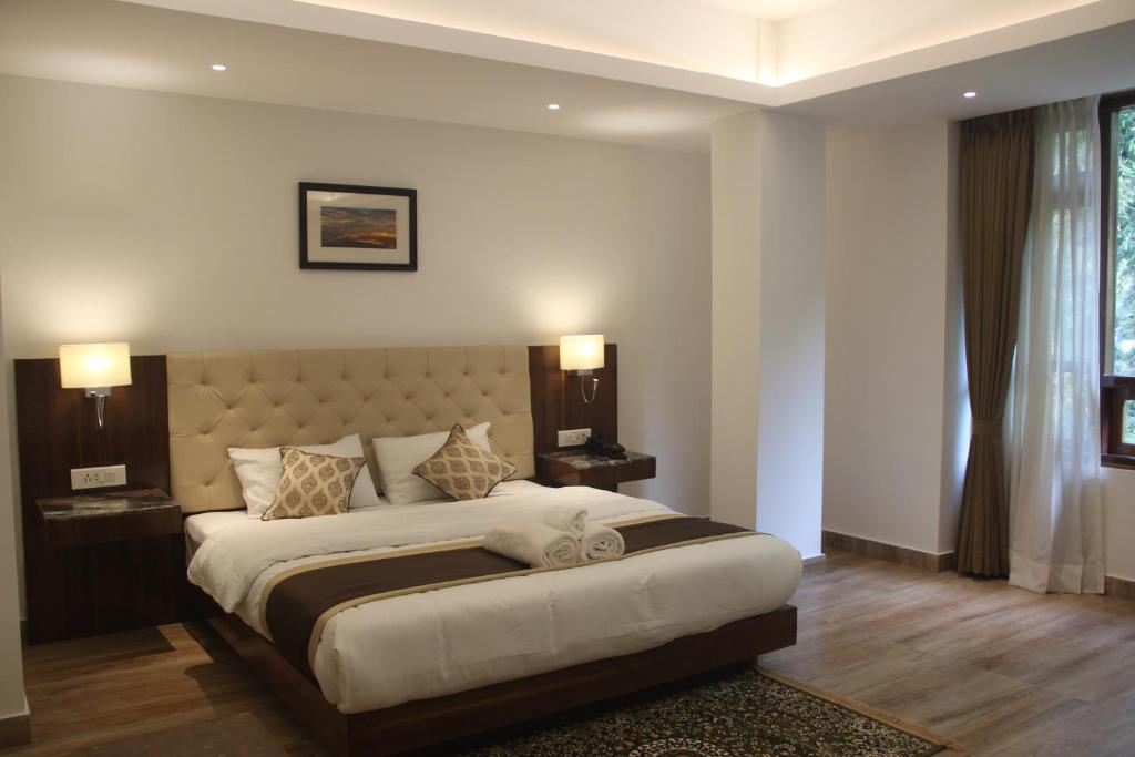 Een bed of bedden in een kamer bij Ecotel Chiminda Abode