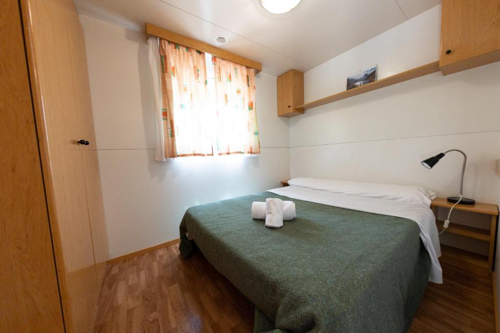 Postel nebo postele na pokoji v ubytování Bungalowpark Isábena