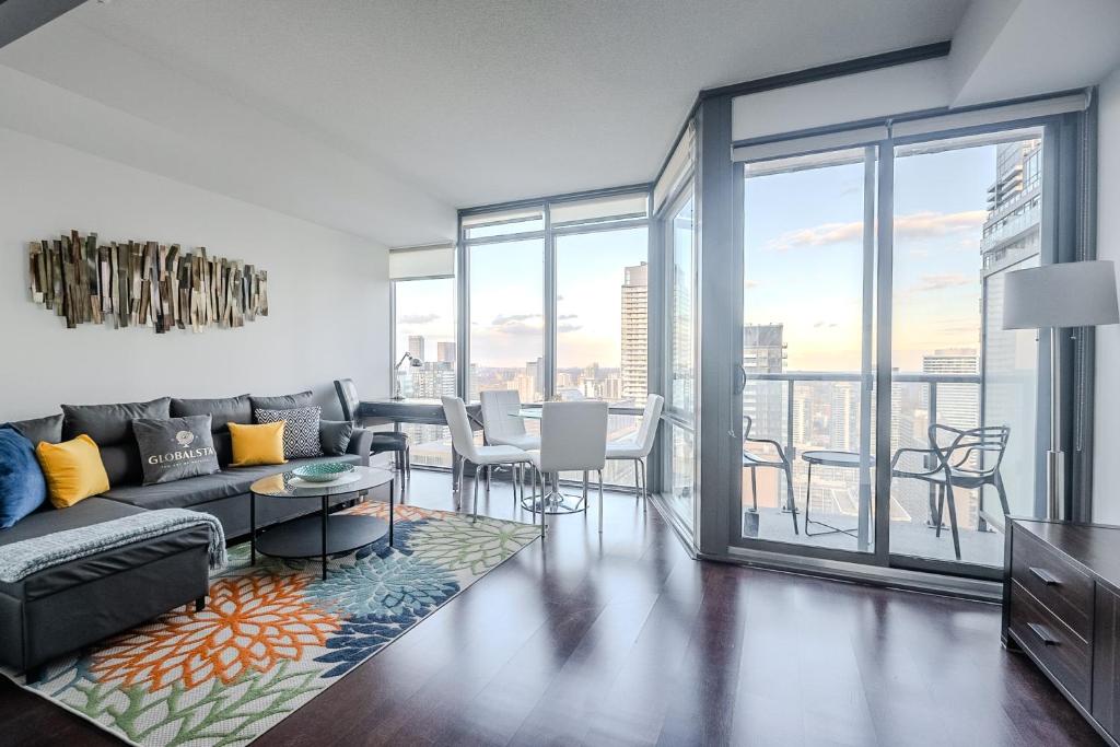 a living room with a couch and a table at Globalstay. Burano Condos in Downtown Toronto in Toronto