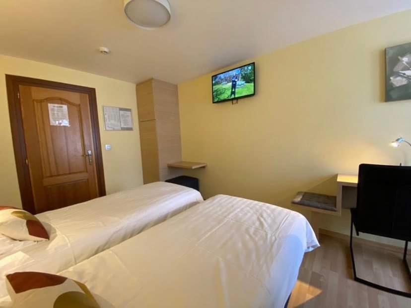 Postel nebo postele na pokoji v ubytování Hotel Beau Site
