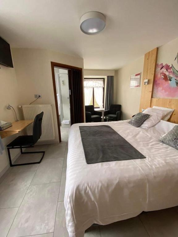 Postel nebo postele na pokoji v ubytování Hotel Beau Site