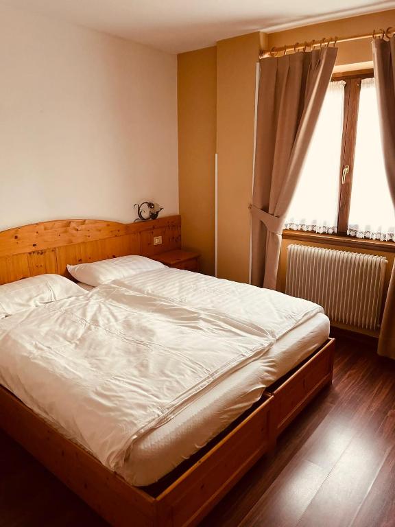 Postel nebo postele na pokoji v ubytování Garnì Bonsai