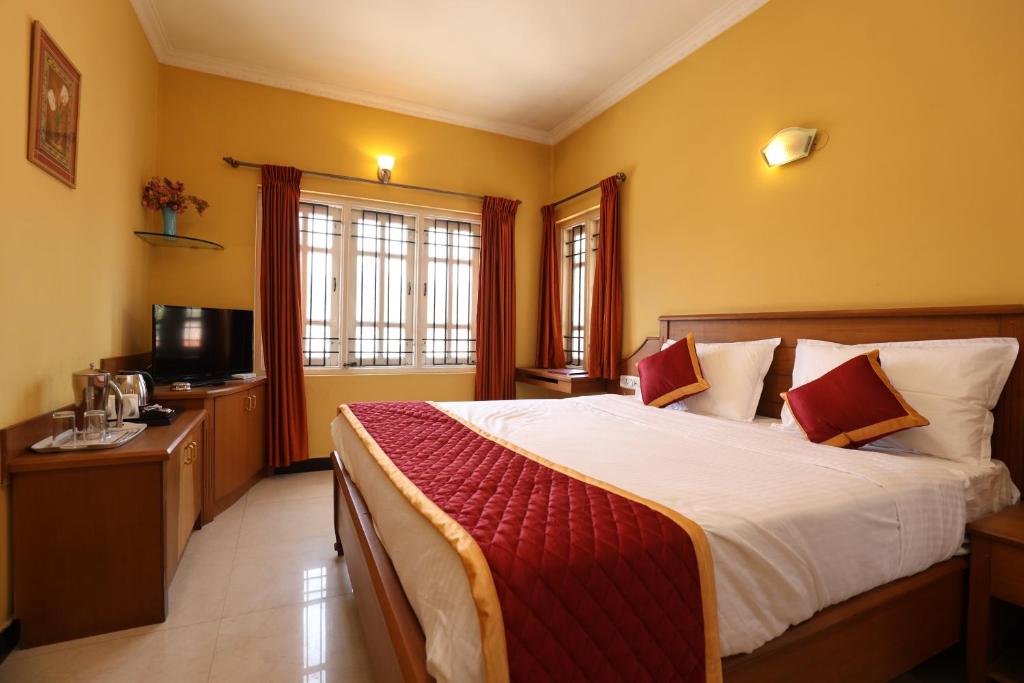 Postel nebo postele na pokoji v ubytování Hotel Silver Oak
