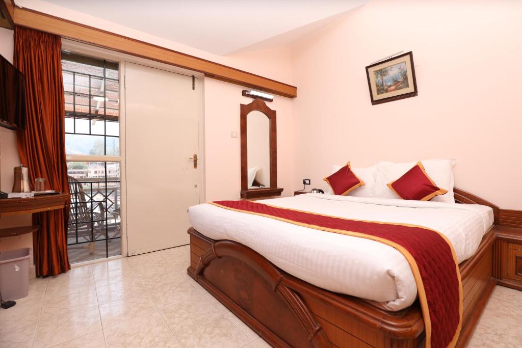 Postel nebo postele na pokoji v ubytování Hotel Silver Oak