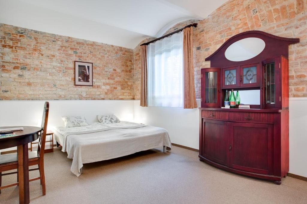 Postel nebo postele na pokoji v ubytování Janne Hotel
