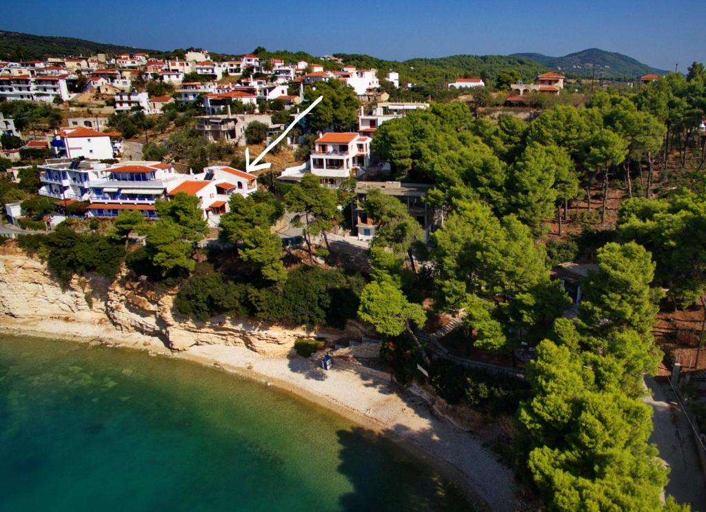 an aerial view of a village on the beach at VILLA DOLPHIN VOTSI in Votsi