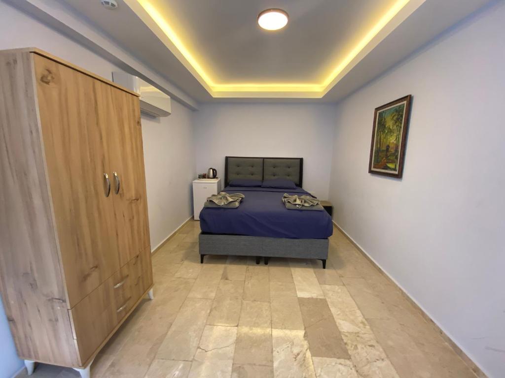 Postel nebo postele na pokoji v ubytování Mert Homes Marmaris