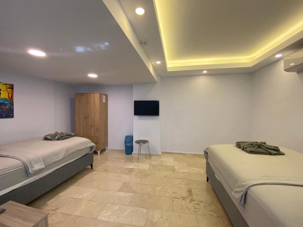 Postel nebo postele na pokoji v ubytování Mert Homes Marmaris