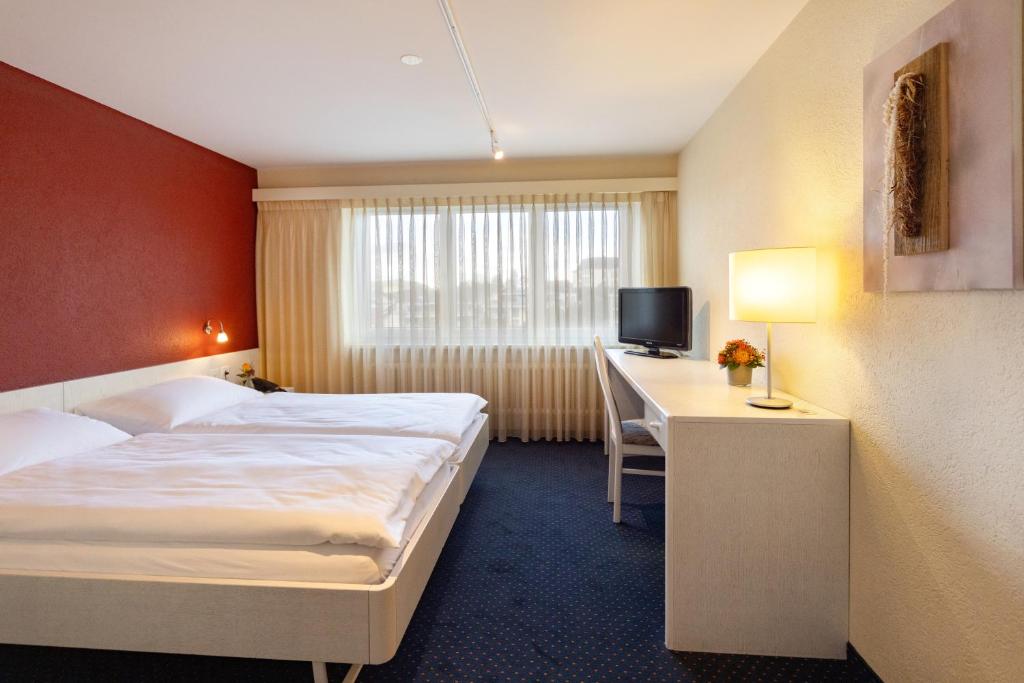 Postel nebo postele na pokoji v ubytování Hotel Drei Könige