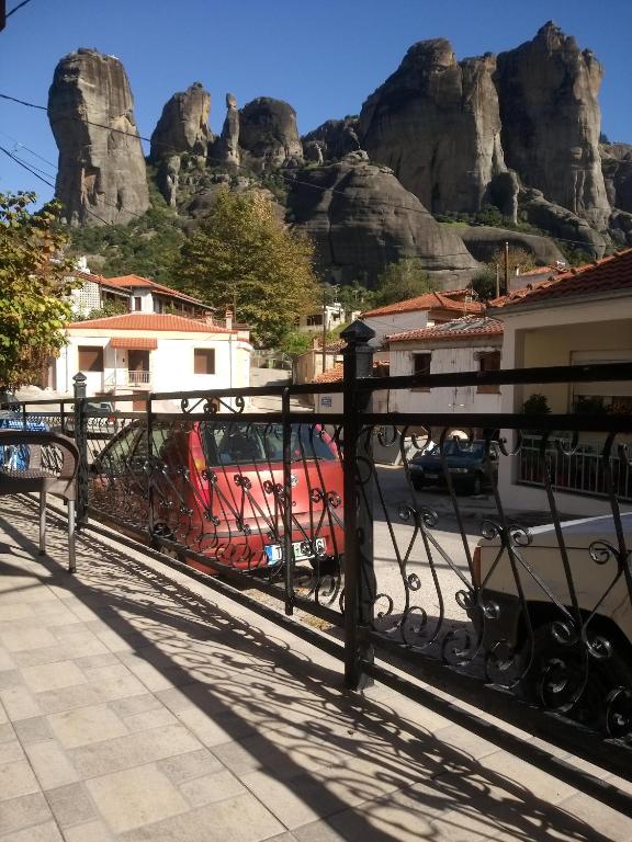 a black fence with a view of the mountains at Argiris Old City House 2 in Kalabaka