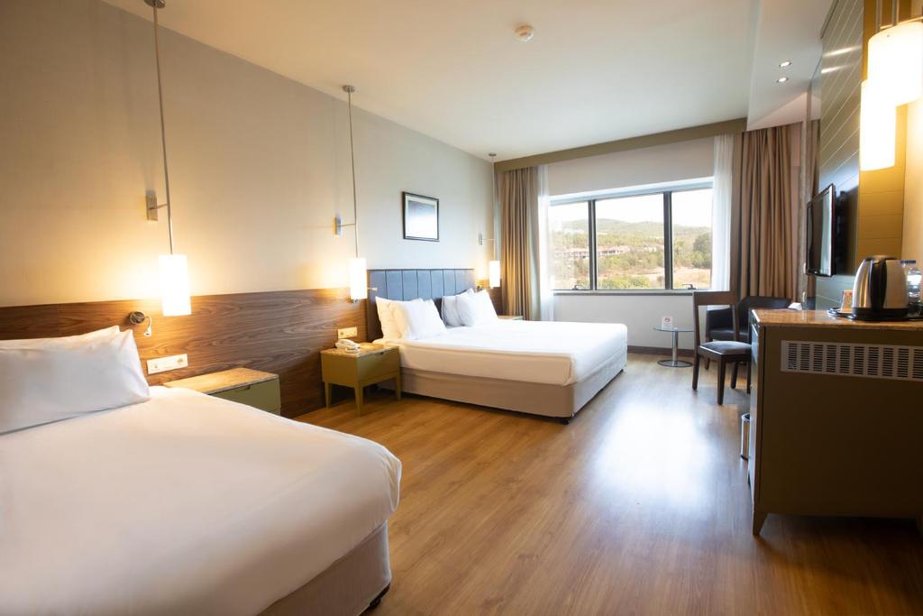 Postel nebo postele na pokoji v ubytování Kolin Hotel Spa & Convention Center
