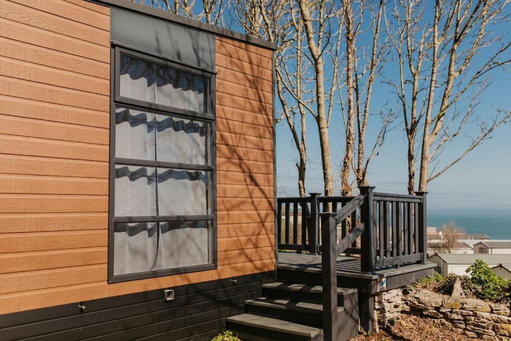 a house with a window on the side of it at Studio Pod 1 in Portland