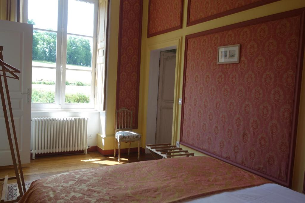 Postel nebo postele na pokoji v ubytování Château de Mauvilly