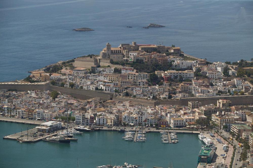 an aerial view of a city with boats in the water at Costa Ibiza Alquiler anual in Talamanca