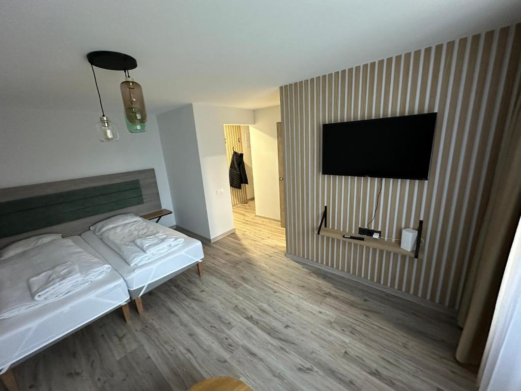 Postel nebo postele na pokoji v ubytování NERO apartamentai
