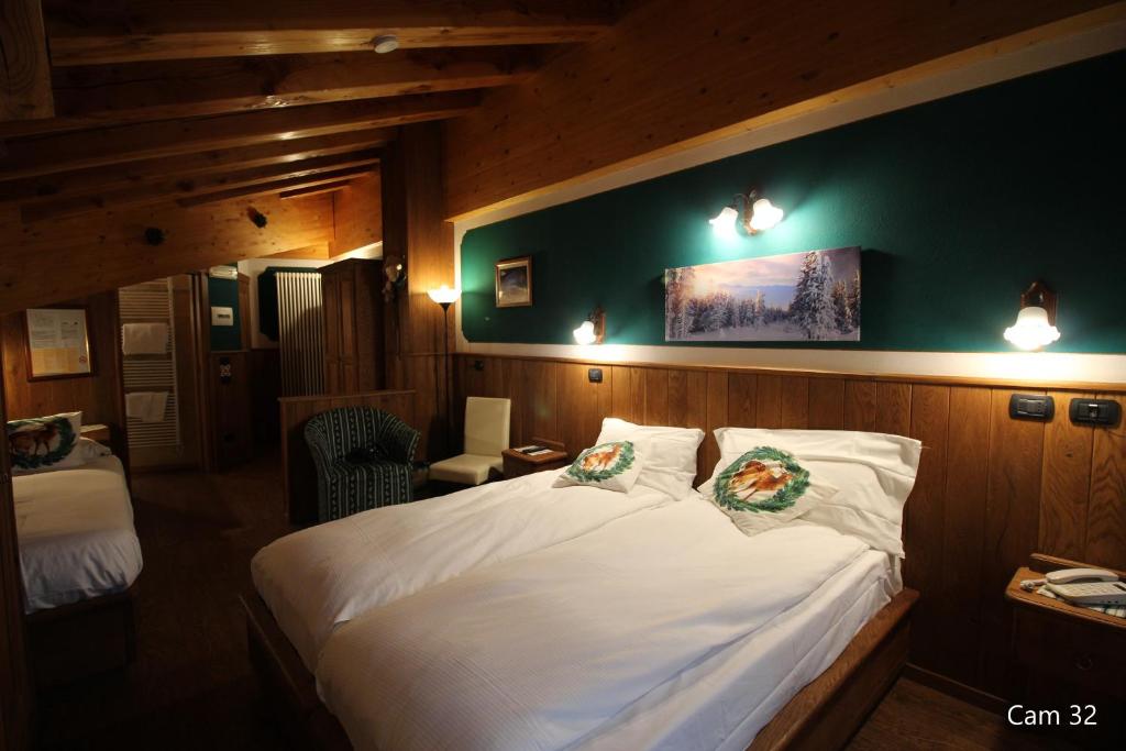 Llit o llits en una habitació de Hotel Meynet