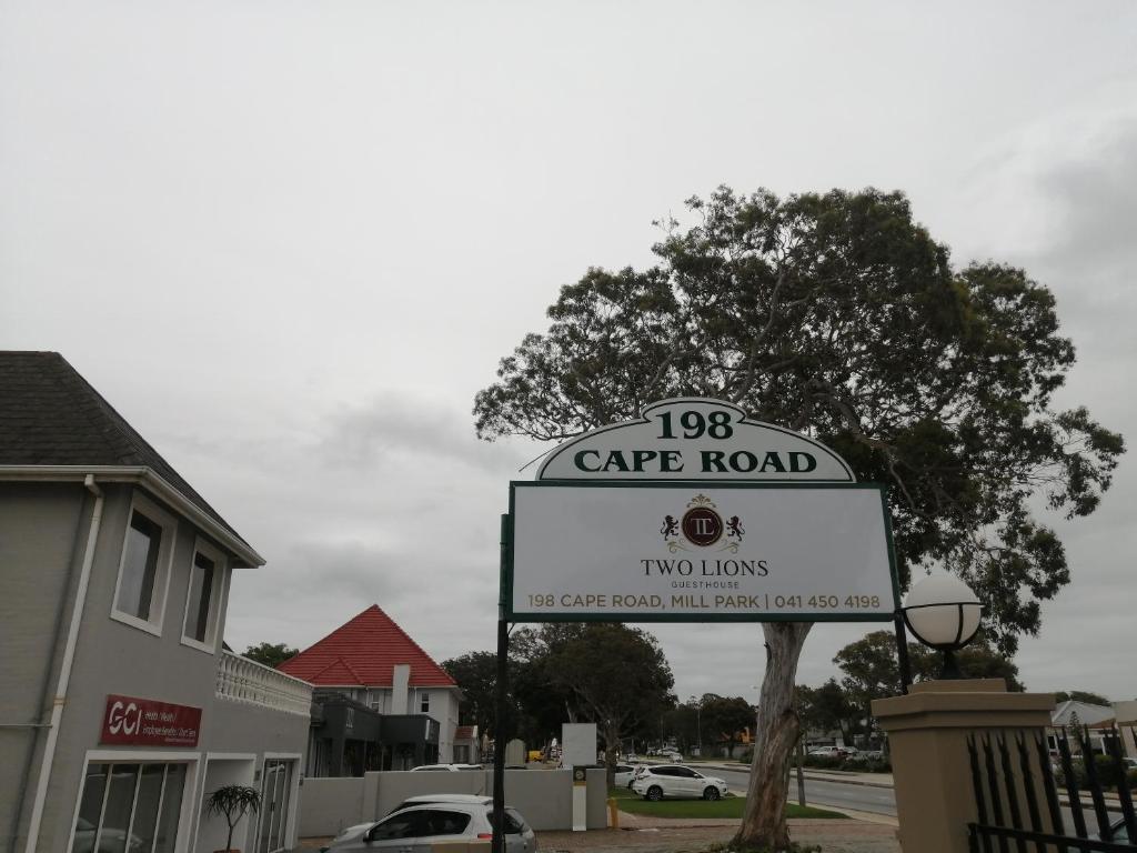 a sign for a cape road in front of a building at Two Lions Guesthouse in Glendinningvale