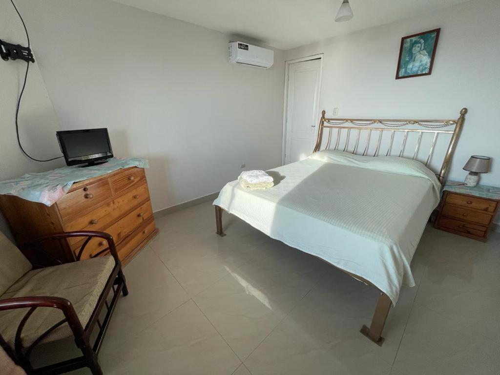 Postel nebo postele na pokoji v ubytování Hostal Cabañas Vistamar