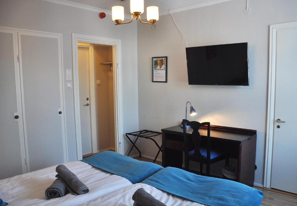Postel nebo postele na pokoji v ubytování Slite Badhotell