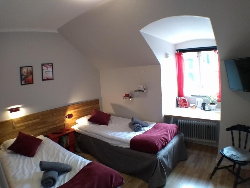 Postel nebo postele na pokoji v ubytování Slite Badhotell