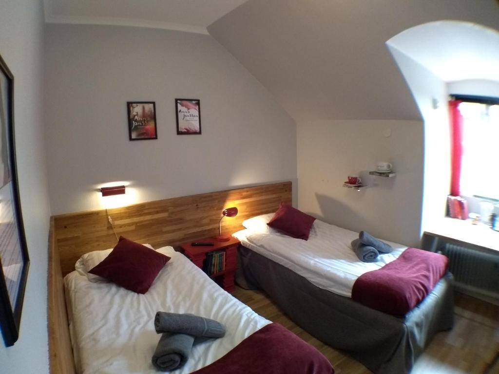Postel nebo postele na pokoji v ubytování Slite Badhotell