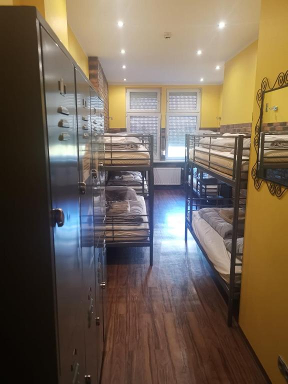A bed or beds in a room at Do Step Inn Home - Hotel & Hostel