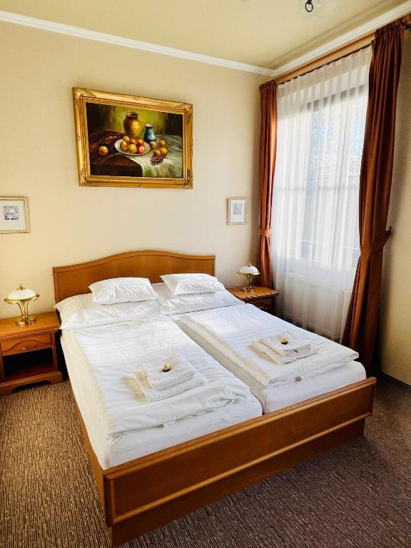 Postel nebo postele na pokoji v ubytování Penzion Villa Ancora