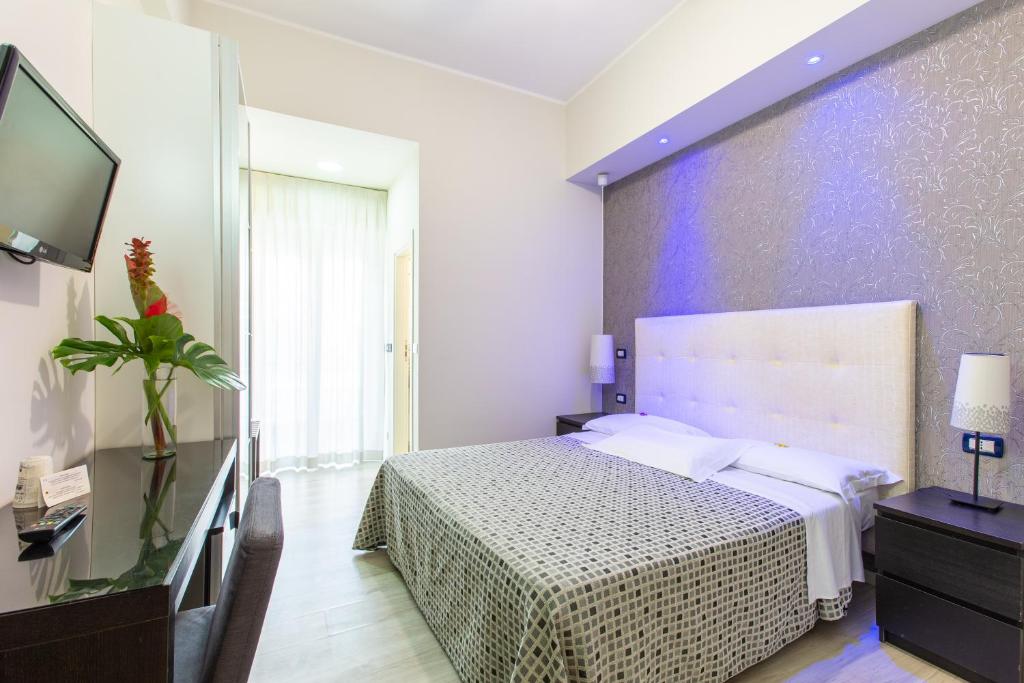 Postel nebo postele na pokoji v ubytování Hotel Gardenia