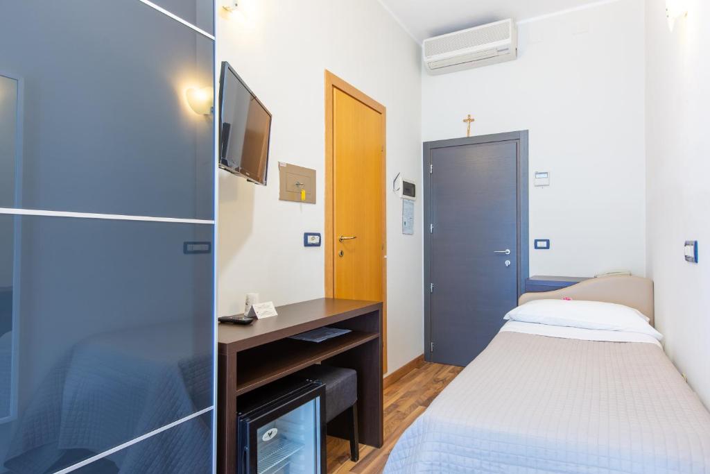 Postel nebo postele na pokoji v ubytování Hotel Gardenia