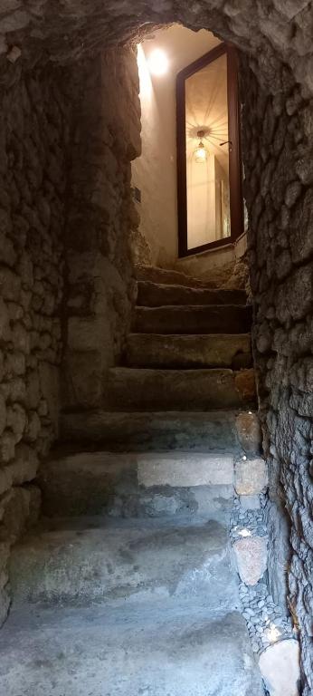 a stairway with a window in a stone building at Charming Village Getaway in Bonnieux in Bonnieux