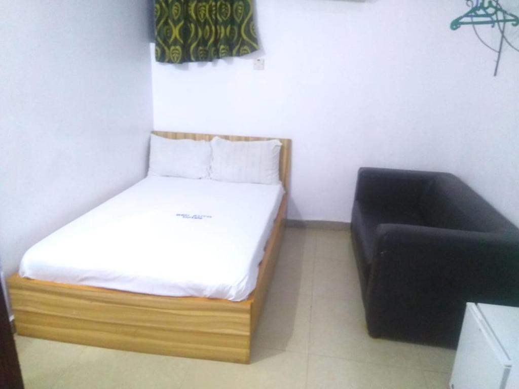 Postel nebo postele na pokoji v ubytování BEN AUTO Hotel