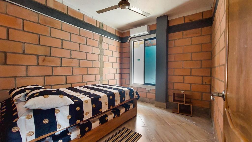 Postel nebo postele na pokoji v ubytování Cabañas Oasis