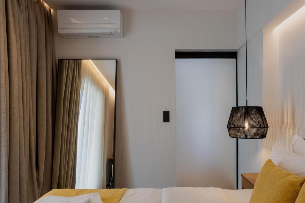 Postel nebo postele na pokoji v ubytování Eudaimonia - Luxury Apartment in Agrinio