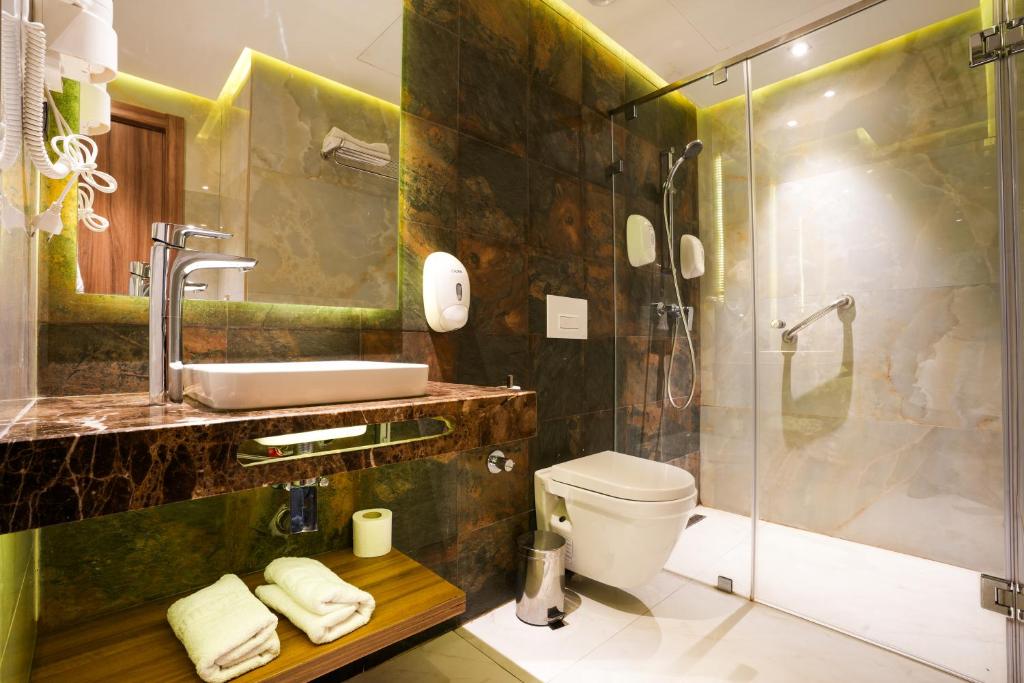 Koupelna v ubytování First Suites Hôtel