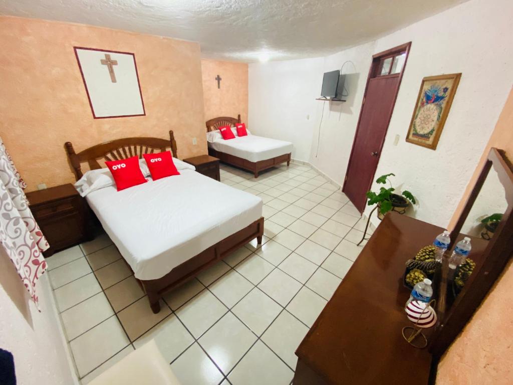 Postel nebo postele na pokoji v ubytování Hotel Fernando´s