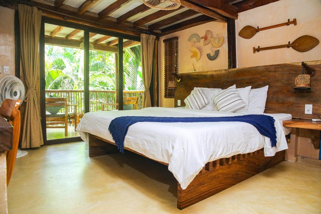 Postel nebo postele na pokoji v ubytování Masaya Tayrona & Beach Club