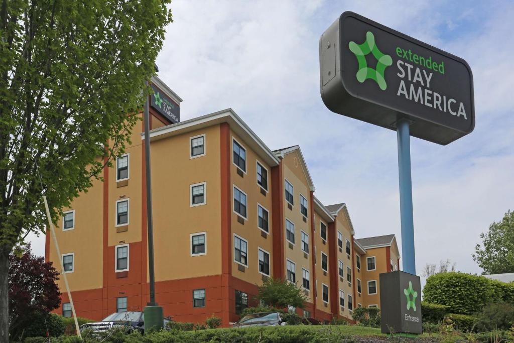 a sign for stay america in front of a building at Extended Stay America Suites - Philadelphia - Plymouth Meeting - East in Plymouth Meeting