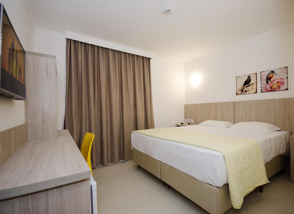 Postel nebo postele na pokoji v ubytování Pena Branca Hotel e Eventos