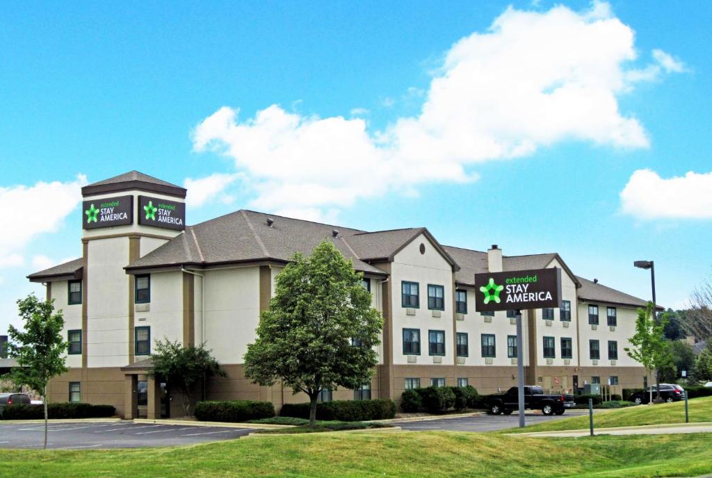 a large building with a sign in front of it at Extended Stay America Suites - Columbus - NE - I-270 in Gahanna