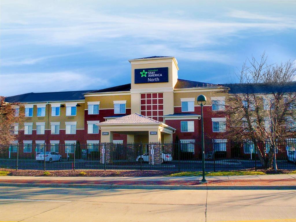 a large building with a sign on top of it at Extended Stay America Suites - Cleveland - Beachwood - Orange Place - North in Orange