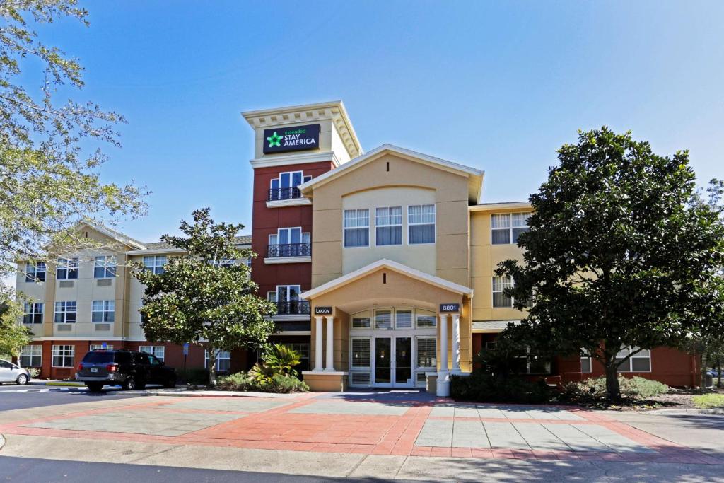 a building with a sign on top of it at Extended Stay America Suites - Jacksonville - Deerwood Park in Jacksonville