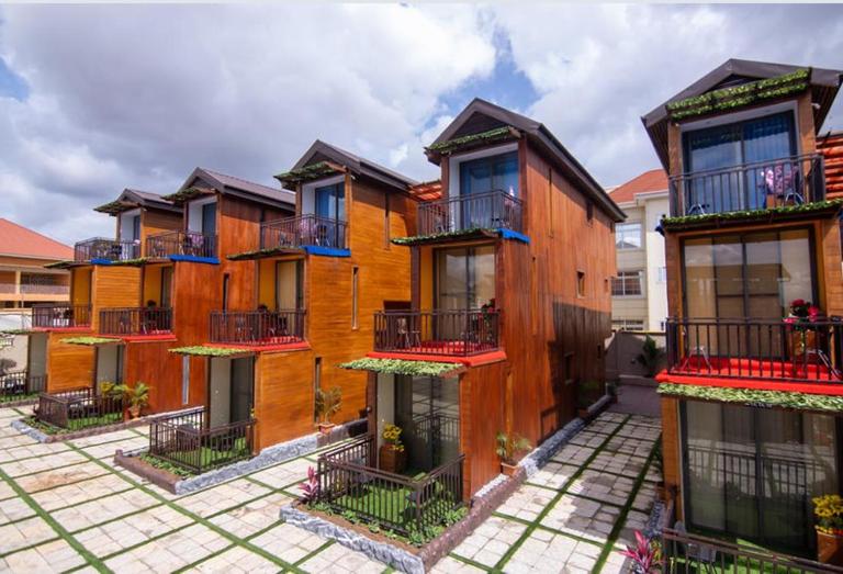 a group of houses with balconies on them at Wisdom Villa in Kumasi