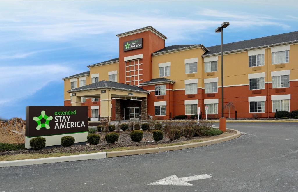 a hotel with a sign in front of a building at Extended Stay America Suites - Meadowlands - East Rutherford in East Rutherford