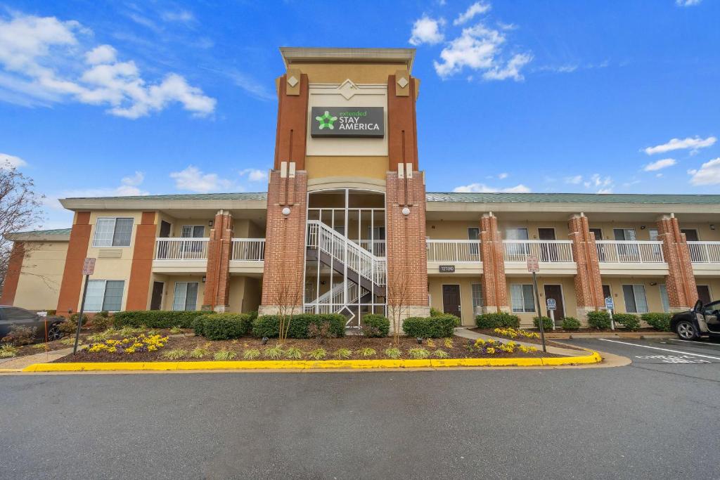 a building with a clock on the front of it at Extended Stay America Suites - Washington, DC - Reston in Herndon