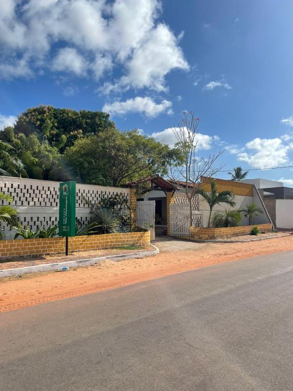 a fence on the side of a road at Chalés São Domingos in Barreirinhas